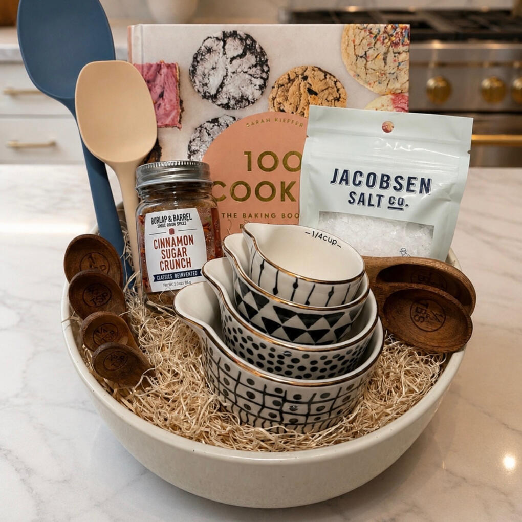 Baker's gift box with cookbook, measuring cups and spices